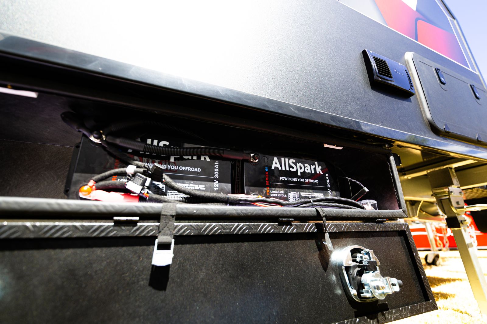 Multiple AllSpark lithium batteries installed inside an external chassis-mount battery box